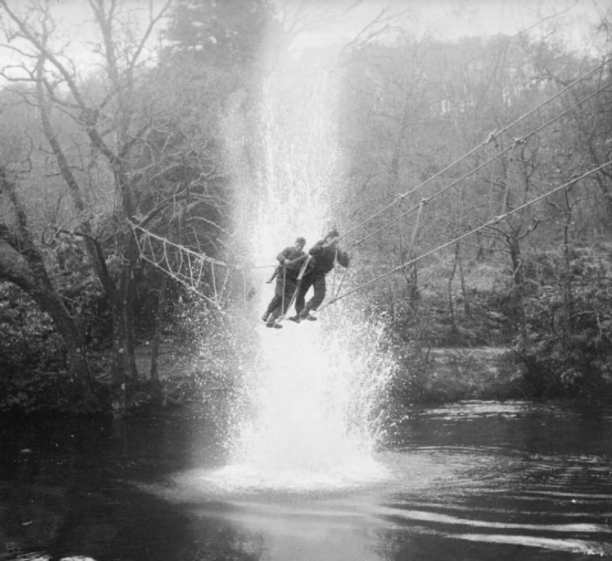 Commandos practice crossing a river using a toggle bridge Acnacharry Jan 1943